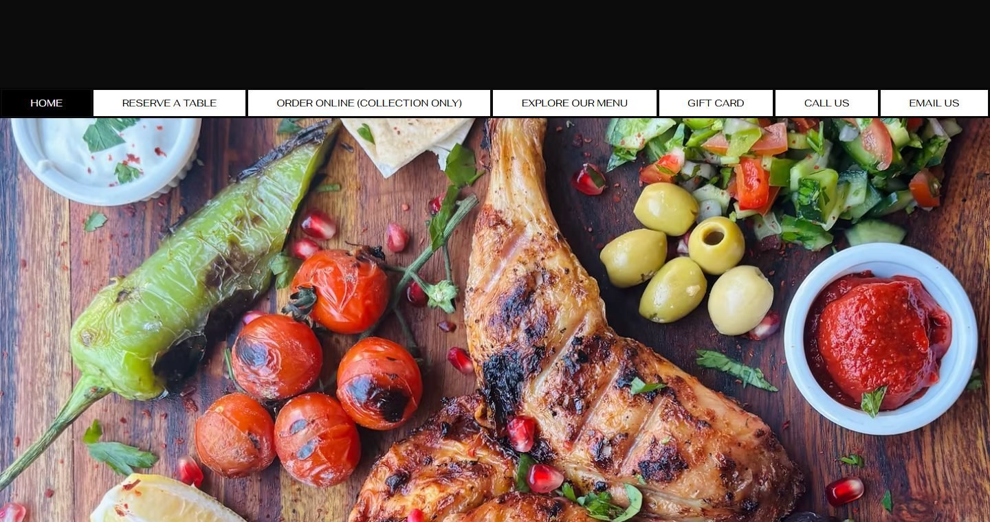 The original restaurant website, with a boxed button menu above a food photo
